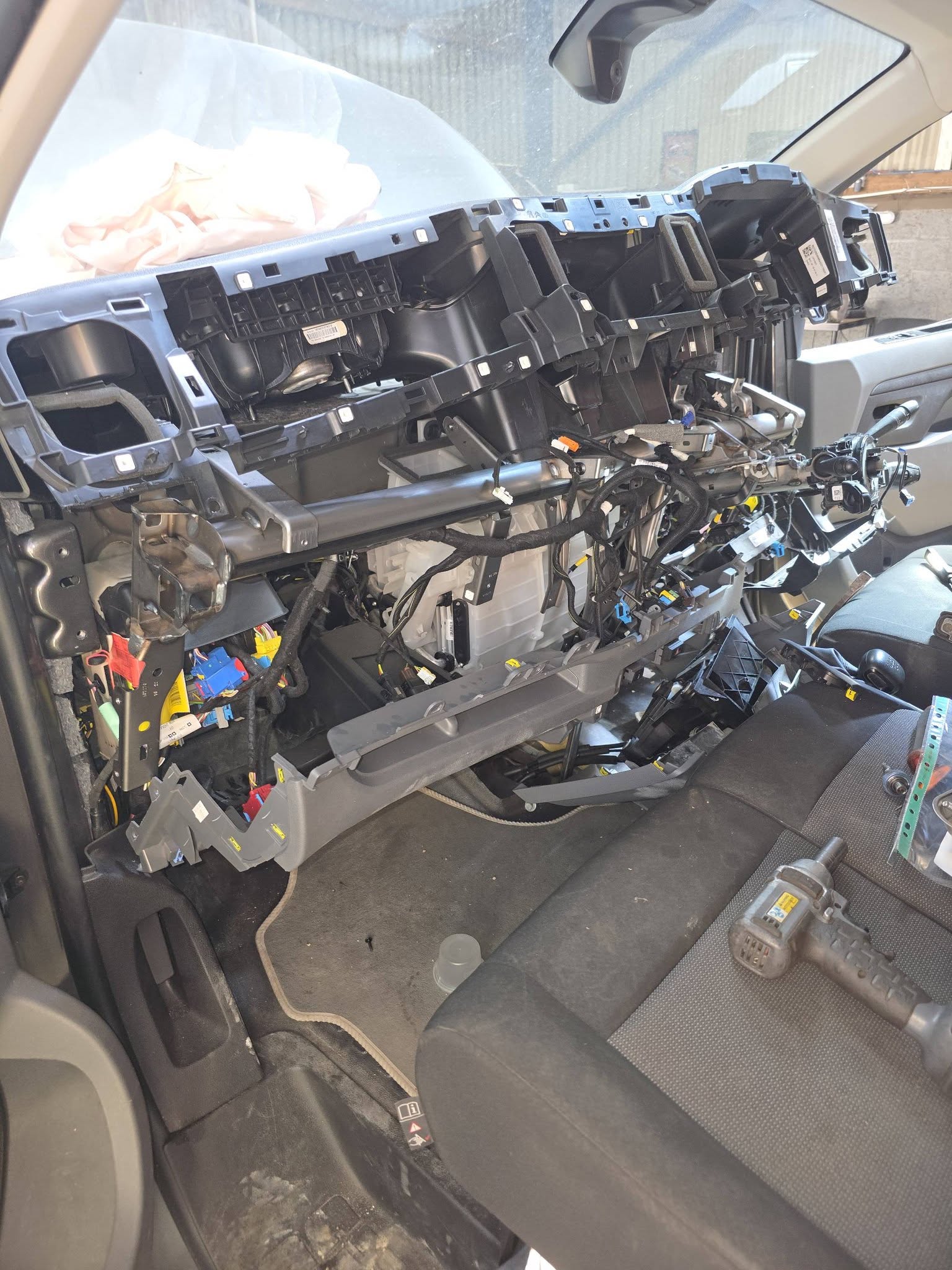 The same van's dashboard stripped right back to the bare frame